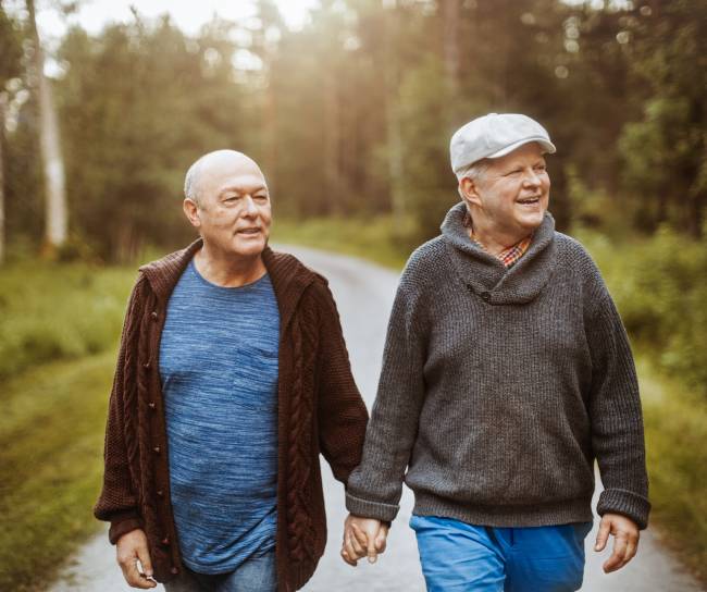 Celebration of life couple walking forest road