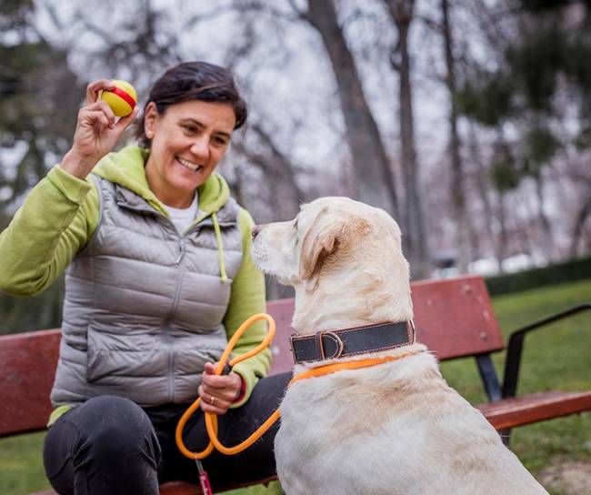 woman and dog in park