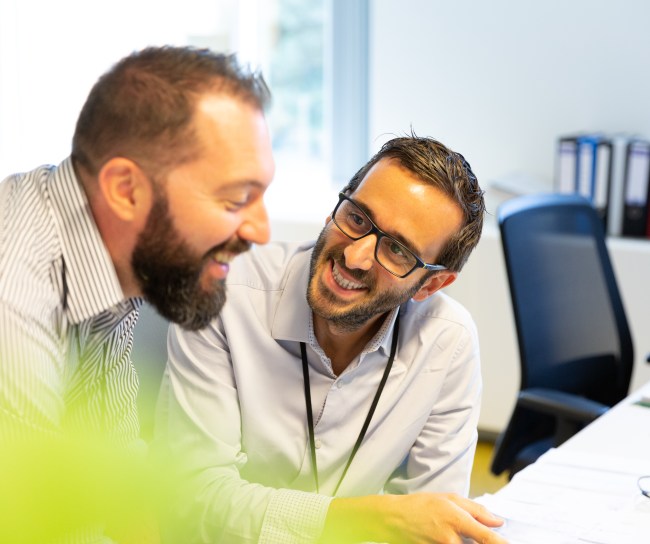 Our employees talking and laughing