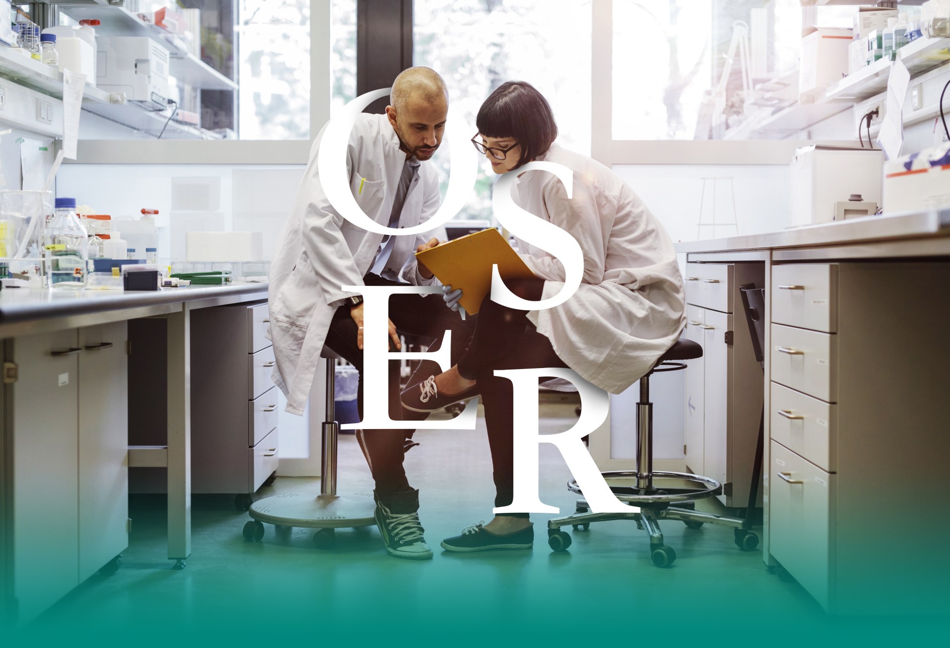 Two scientists inside a laboratory discussing